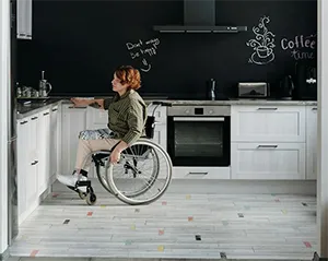 A woman in a wheelchair taking advantage of an ADA kitchen remodel in Vistancia, AZ